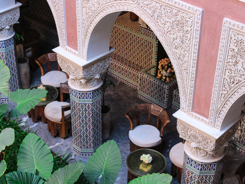 Top view of the Moroccan Riad with original tables and chairs, c Cities to Experience Local Culture - Marrakech